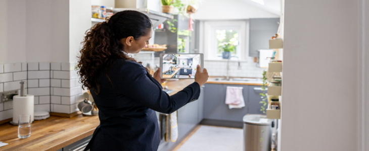 Real estate agent taking pictures of a home