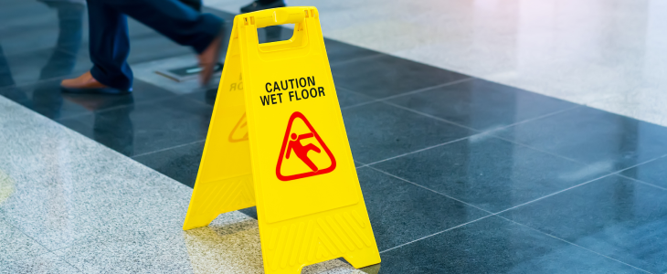 Caution wet floor sign to represent a potential slip and fall accident