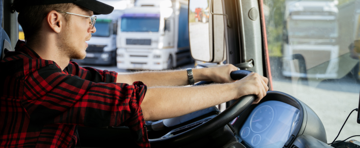 Young new truck driving getting on the road