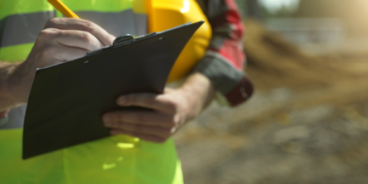 Oilfield worker documenting an accident