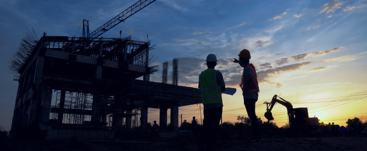 Construction workers looking at a site